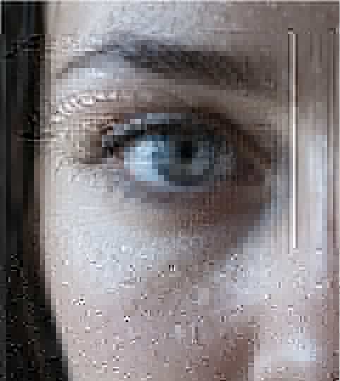 Close-up of an eye with water droplets on the skin